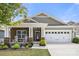 Charming single-Gathering home featuring a well-manicured lawn and stone accents on the front exterior at 1221 Brookcrest Ln, Fort Mill, SC 29708