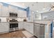 Updated kitchen featuring stainless steel appliances, granite countertops, and ample cabinet space at 1221 Brookcrest Ln, Fort Mill, SC 29708
