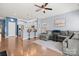 Open-concept living space with hardwood floors, connecting the living room and kitchen areas at 1221 Brookcrest Ln, Fort Mill, SC 29708