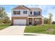 Charming two-story home with brick and vinyl siding, attached garage and manicured front lawn at 1390 6Th Ne St, Hickory, NC 28601