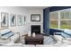 Bright and stylish living room with a fireplace, natural light, and views of the backyard at 1390 6Th Ne St, Hickory, NC 28601