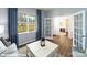 Relaxing living room with hardwood floors, large window, and entry to the bathroom at 1390 6Th Ne St, Hickory, NC 28601