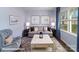 Cozy living room with large window, comfortable seating, stylish decor, and natural light at 1390 6Th Ne St, Hickory, NC 28601