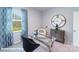 Stylish home office with a glass-top desk, modern furniture, and a large window with a serene outdoor view at 1390 6Th Ne St, Hickory, NC 28601