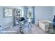 Bright home office featuring a glass desk, a comfortable chair, and a window with ample natural light at 1390 6Th Ne St, Hickory, NC 28601