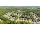 An aerial view displays the layout of a neighborhood with lush greenery and various home styles at 1607 Essex Hall Dr, Rock Hill, SC 29730