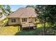 Backyard view with deck and siding showing large, lovely property on a sunny day at 1607 Essex Hall Dr, Rock Hill, SC 29730