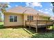 Backyard showcasing a home with large windows, siding and a wooden deck; perfect for outdoor activities at 1607 Essex Hall Dr, Rock Hill, SC 29730