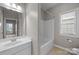 Cozy bathroom with a shower and tub combo, single sink vanity and tile flooring at 1607 Essex Hall Dr, Rock Hill, SC 29730