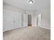 Bright bedroom with plush carpeting, neutral walls, a double door closet and ensuite bathroom at 1607 Essex Hall Dr, Rock Hill, SC 29730