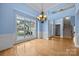 Well-lit dining room with hardwood floors and large window with a view at 1607 Essex Hall Dr, Rock Hill, SC 29730
