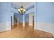 Spacious dining area showcasing hardwood floors and a view to the stairway at 1607 Essex Hall Dr, Rock Hill, SC 29730