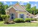 Beautiful home with classic brick and siding, framed by lush landscaping and manicured green lawn at 1607 Essex Hall Dr, Rock Hill, SC 29730