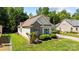 Well-maintained home featuring a combination of brick and siding, surrounded by lush, green landscaping at 1607 Essex Hall Dr, Rock Hill, SC 29730