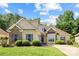 Charming home with a manicured lawn, complemented by classic brick and siding facade, showcasing curb appeal at 1607 Essex Hall Dr, Rock Hill, SC 29730
