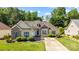 Charming home with a well-manicured lawn, a concrete driveway, and tasteful landscaping at 1607 Essex Hall Dr, Rock Hill, SC 29730