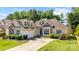 Inviting home featuring a two-car garage, mature landscaping, and a concrete driveway at 1607 Essex Hall Dr, Rock Hill, SC 29730