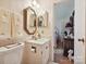 Cozy bathroom with patterned wallpaper, decorative mirrors, and an adjoining bedroom view at 208 Armstrong Dr, Belmont, NC 28012