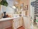 Charming bathroom featuring a vanity, mirror, and floral wallpaper at 208 Armstrong Dr, Belmont, NC 28012