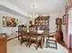 Elegant dining room with wooden table, chandelier, and china cabinet at 208 Armstrong Dr, Belmont, NC 28012