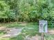 Disc golf course featuring lush greenery and shade trees for an enjoyable outdoor experience at 208 Armstrong Dr, Belmont, NC 28012