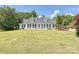 Attractive one-story brick home featuring dormer windows and a spacious front lawn at 208 Armstrong Dr, Belmont, NC 28012