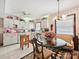 Bright kitchen with white cabinets, a dining nook, and modern appliances at 208 Armstrong Dr, Belmont, NC 28012