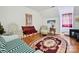 Living room with hardwood floors, sitting area and decorative oval rug at 208 Armstrong Dr, Belmont, NC 28012