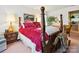 Bedroom with a four-poster bed, elegant decor, and comfortable furnishings at 208 Armstrong Dr, Belmont, NC 28012