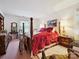 Bedroom featuring a four-poster bed, dresser, and natural light from a window at 208 Armstrong Dr, Belmont, NC 28012