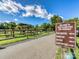 A park sign shows the various park amenities, dog park, fishing pier, and canoe portages at 208 Armstrong Dr, Belmont, NC 28012