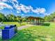 Covered picnic area in a park setting with picnic tables and trash and recycling bins available at 208 Armstrong Dr, Belmont, NC 28012