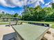 Outdoor ping pong tables available in a park setting with covered picnic areas and lush greenery at 208 Armstrong Dr, Belmont, NC 28012