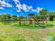 Vibrant park playground with climbing structures and activities surrounded by green grass at 208 Armstrong Dr, Belmont, NC 28012