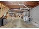 Spacious unfinished basement area with washer and dryer at 2113 Woodlawn St, Kannapolis, NC 28083