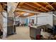 Unfinished basement with work bench, exposed ceiling and cinder block walls at 2113 Woodlawn St, Kannapolis, NC 28083