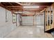 Unfinished basement area with concrete floors and exposed ceiling. Includes garage access at 2113 Woodlawn St, Kannapolis, NC 28083