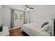 Serene bedroom featuring hardwood floors, a large window, and neutral decor at 2113 Woodlawn St, Kannapolis, NC 28083