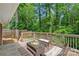Relaxing outdoor deck with seating, ideal for enjoying the surrounding lush greenery at 2113 Woodlawn St, Kannapolis, NC 28083