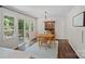 Cozy dining area with wood floors, sliding glass doors, and ample natural light at 2113 Woodlawn St, Kannapolis, NC 28083