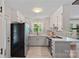 Bright kitchen featuring modern stainless steel appliances, white cabinetry and lots of light at 2113 Woodlawn St, Kannapolis, NC 28083