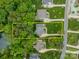 An aerial view showcasing the expansive property with mature trees, manicured lawn, and defined property lines at 212 Seven Oaks Lndg, Belmont, NC 28012