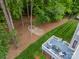Aerial view of the deck, fire pit, and well-manicured backyard, showcasing the outdoor living space at 212 Seven Oaks Lndg, Belmont, NC 28012