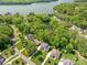 Breathtaking view overlooking homes, a pond, and a serene lake, highlighting the luxurious neighborhood at 212 Seven Oaks Lndg, Belmont, NC 28012