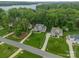 Aerial view of the neighborhood showcasing well-maintained homes and lush greenery at 212 Seven Oaks Lndg, Belmont, NC 28012