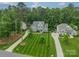 Stunning aerial view of a luxurious home featuring lush landscaping and a long driveway at 212 Seven Oaks Lndg, Belmont, NC 28012