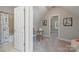 This finished attic space features carpet, a window, and a nearby bathroom with tub and shower at 212 Seven Oaks Lndg, Belmont, NC 28012