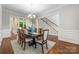 Elegant dining room showcasing a decorative centerpiece and comfortable seating at 212 Seven Oaks Lndg, Belmont, NC 28012