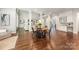 The dining room features hardwood floors and a great view of the living areas at 212 Seven Oaks Lndg, Belmont, NC 28012