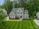 Beautiful two-story home with a well-maintained lawn and landscaping at 212 Seven Oaks Lndg, Belmont, NC 28012